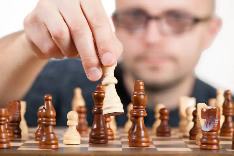 man playing move in chess